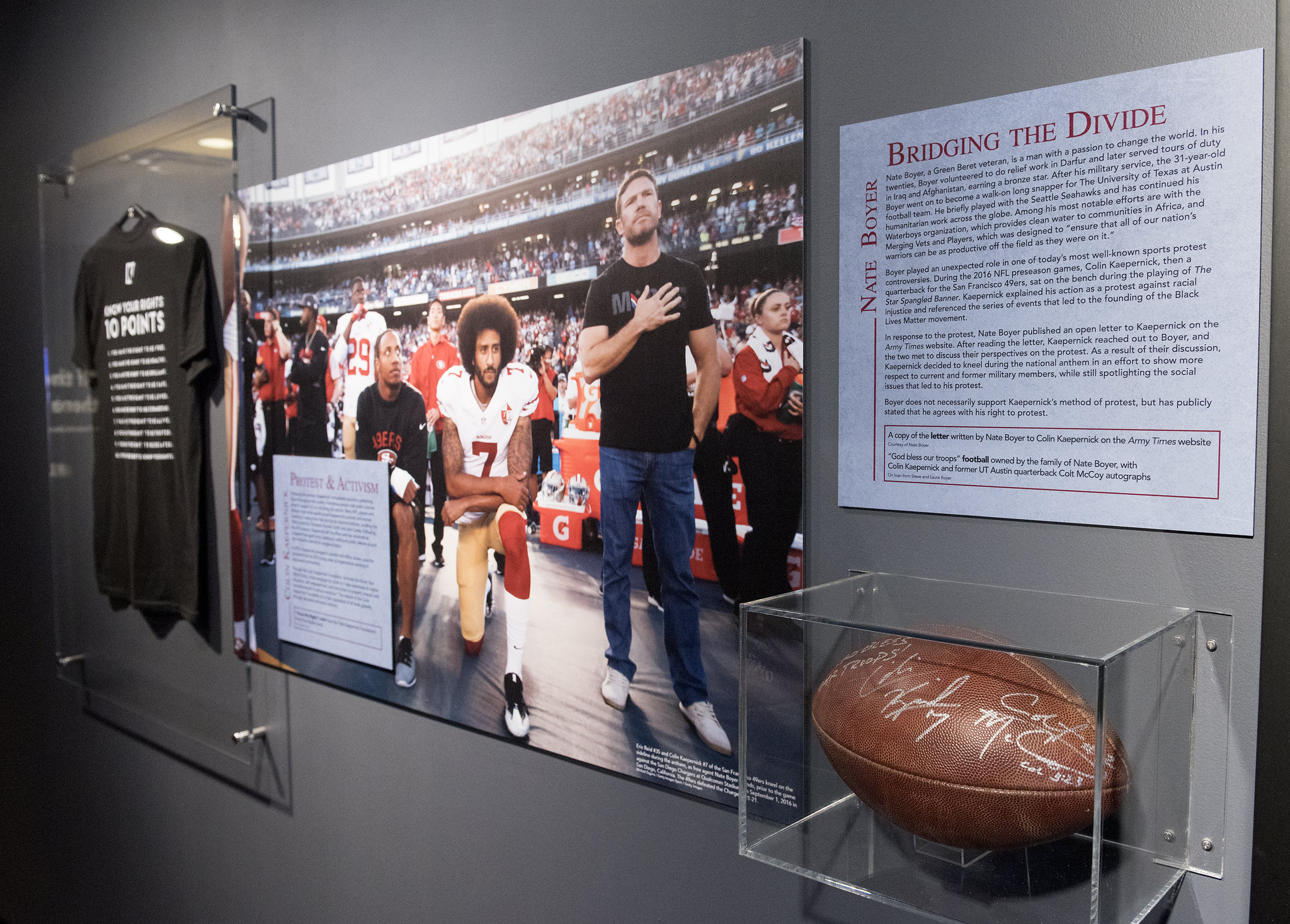 A view of the "Bridging the Divide" area in the "Get in the Game" exhibition, which discusses Nate Boyer and Colin Kaepernick.